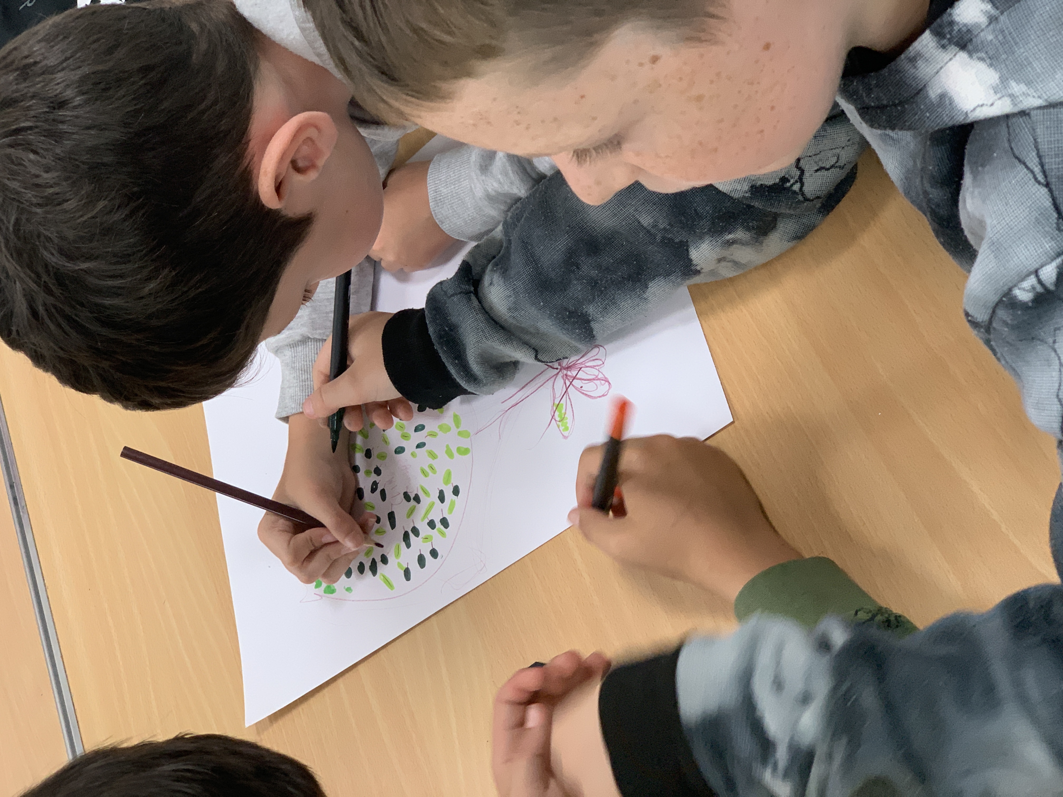 Young people drawing at a Climate Action Town workshop